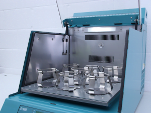 blue laboratory incubator with flask clamps